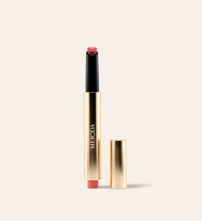 Hydrating Lip Tint in Peachy Rose in a sleek gold metallic pen with a detached cap against a neutral background.