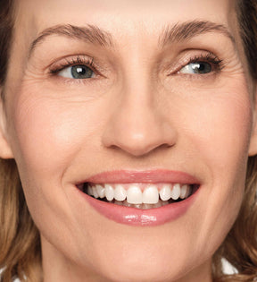 Hydrating Lip Tint in Dusty Rose applied on a model for a soft, natural, and glossy look.