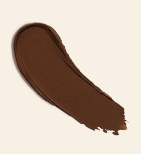 Soft Tan Bronzer creamy texture swatch in shade Deep showing the rich formula for a natural sun-kissed glow.
