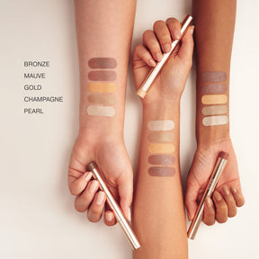 Meroda Cosmetics Eye Perfecting Shimmer Stick swatches in Bronze, Mauve, Gold, Champagne and Pearl on different skin tones.