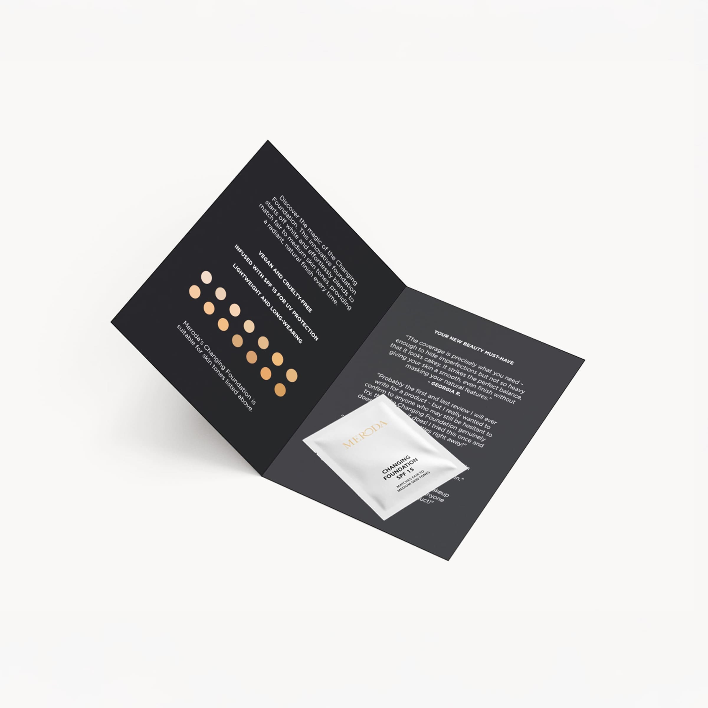 Meroda Cosmetics Changing Foundation Sample 1.5 ml sachet on a black leaflet with shade swatches and reviews