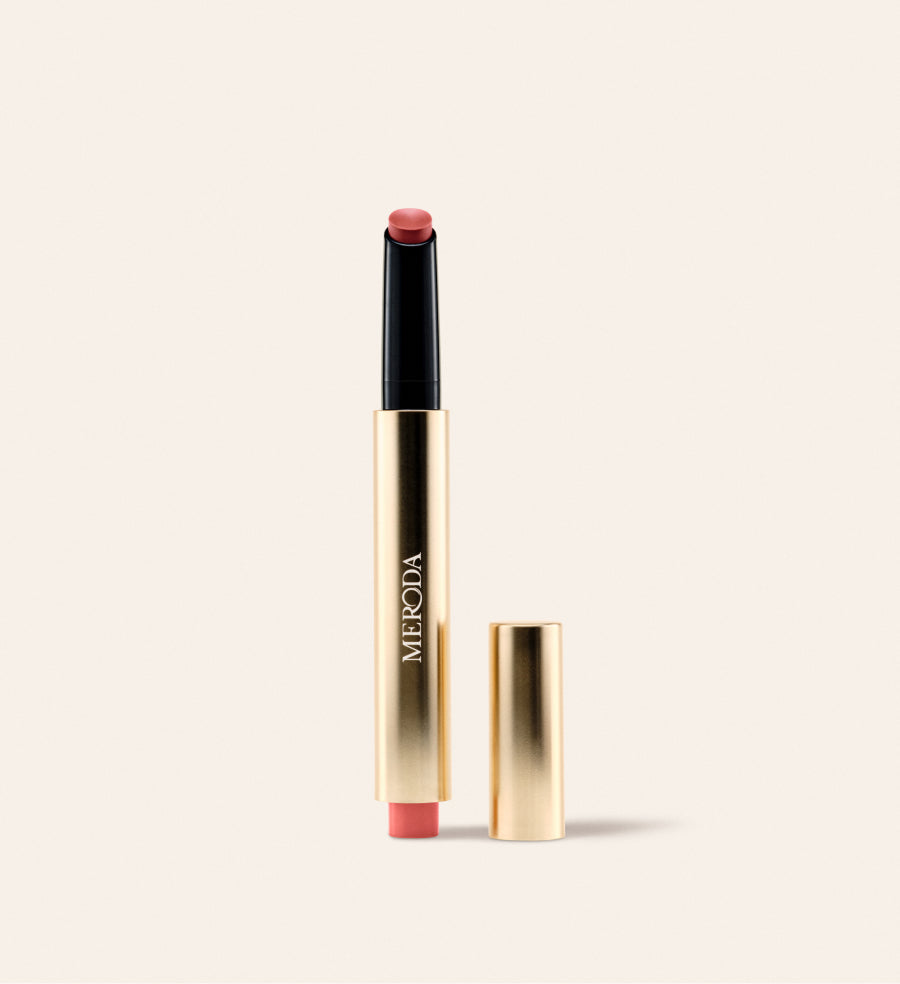 Hydrating Lip Tint in Peachy Rose in a sleek gold metallic pen with a detached cap against a neutral background.