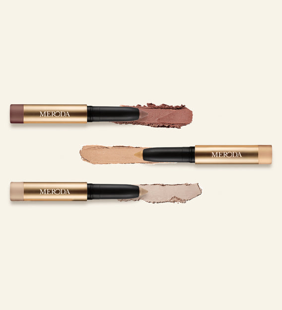 Meroda Cosmetics Mini Eye Shimmer Set with three gold Eye Perfecting Shimmer Sticks and shimmering, creamy swatches.