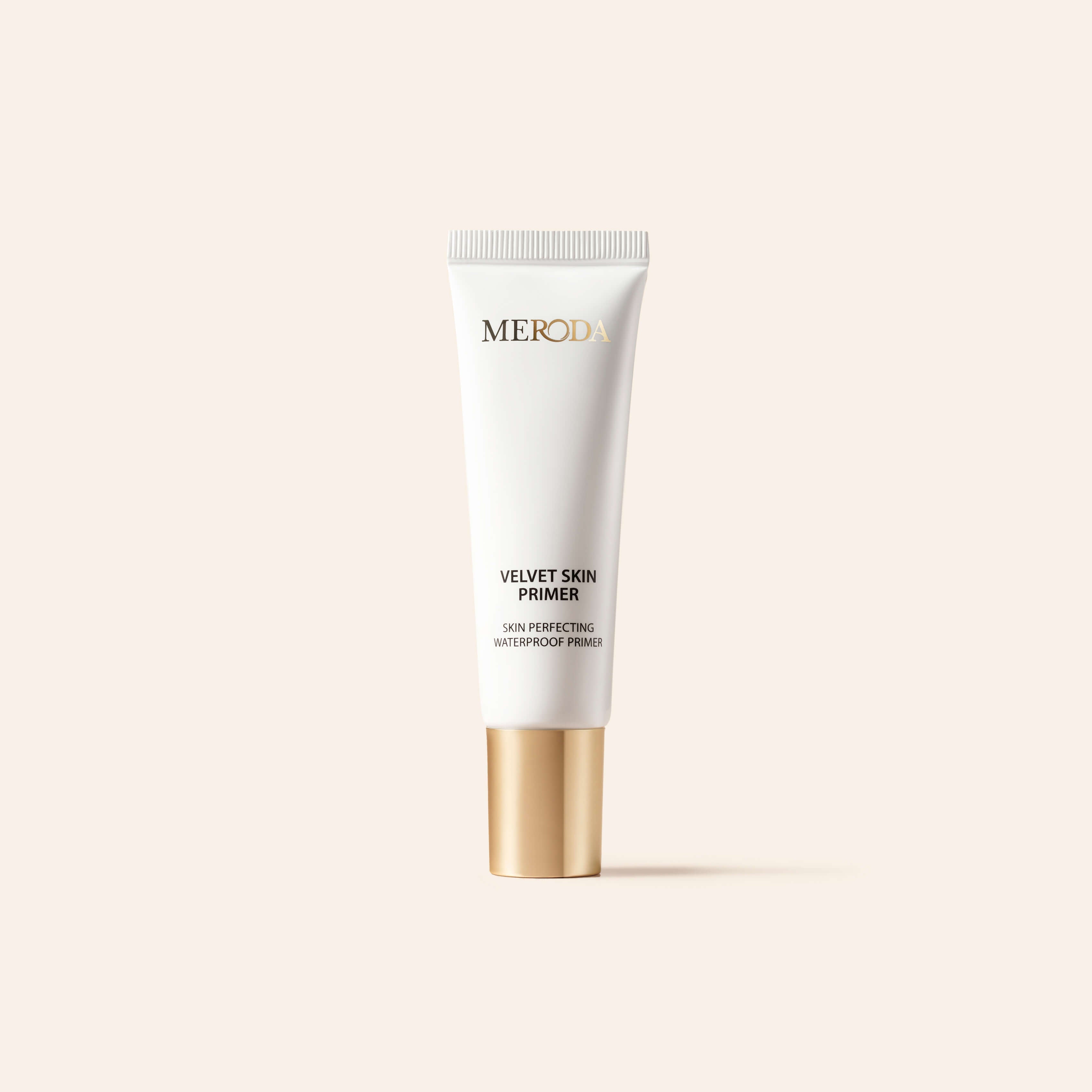 Meroda Cosmetics Mini Primer white tube with a gold cap, a travel-friendly smoothing base that blurs pores and fine lines.