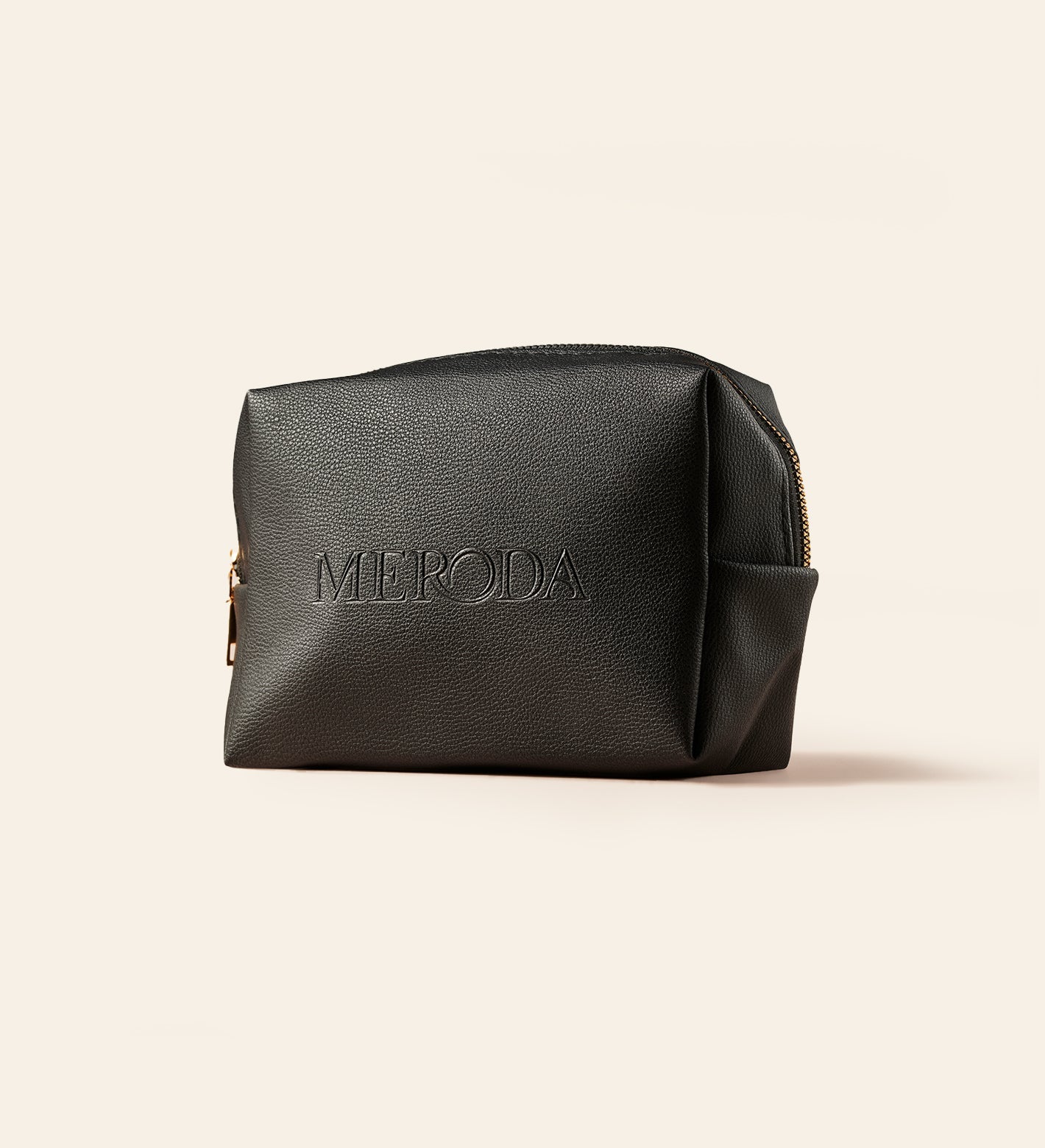 Black pebbled Travel Bag with a structured design and embossed Meroda logo to keep beauty essentials organized