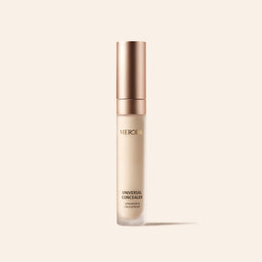 Meroda Cosmetics Universal Concealer tube with a rose gold cap, highlighting longwear and creaseproof benefits.