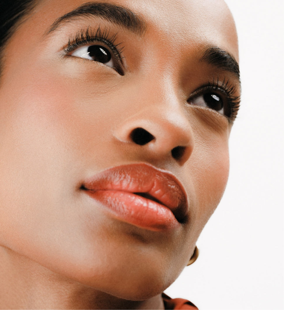 The Key Essentials look on model featuring Changing Foundation for even skin and lengthening Gilded Lashes Mascara.