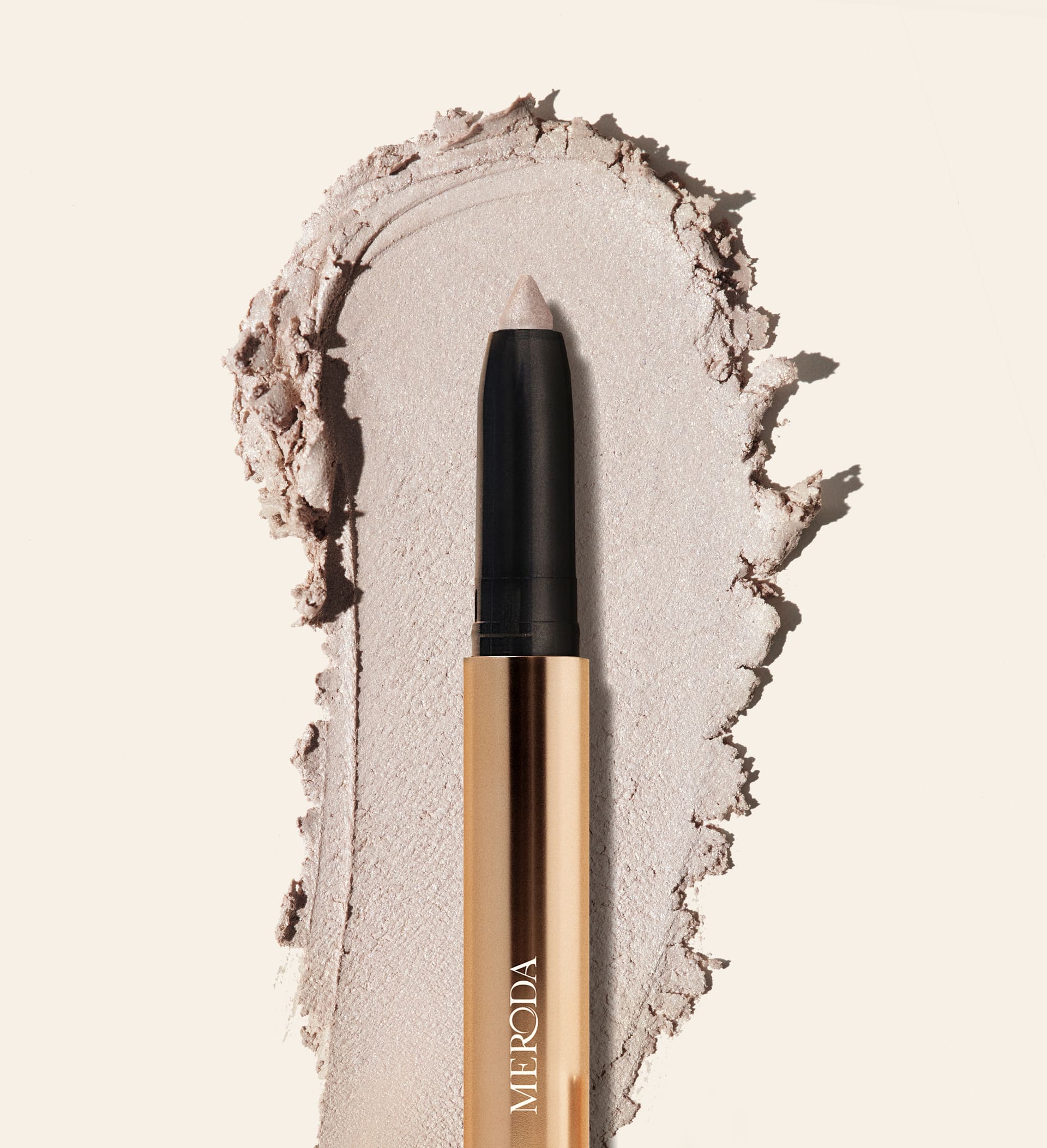 Meroda Eye Perfecting Shimmer Stick in Pearl with a creamy, radiant texture swatch to brighten your eye color.