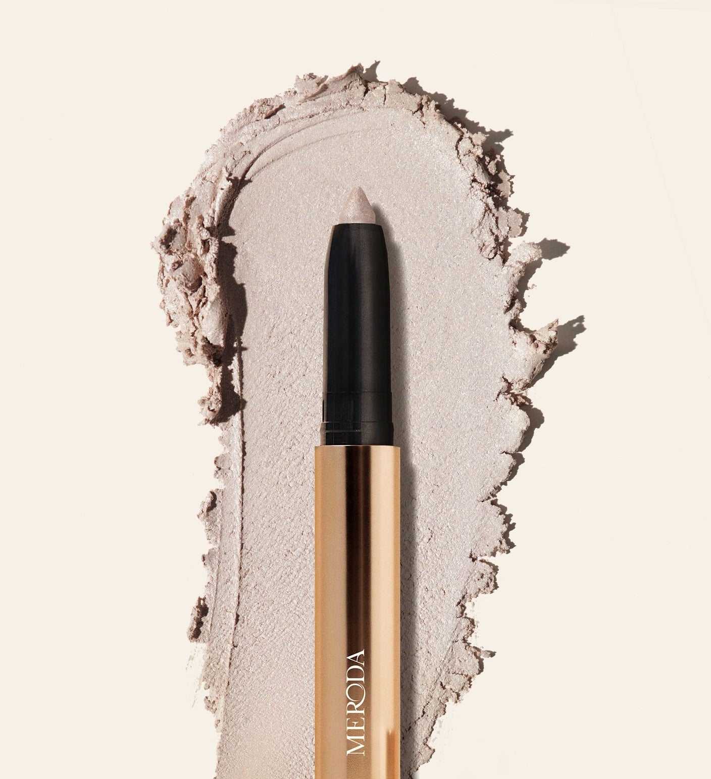 Meroda Eye Perfecting Shimmer Stick in Pearl with a creamy, radiant texture swatch to brighten your eye color.