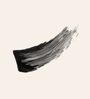Deep black texture swatch of Gilded Lashes Mascara showing the creamy, volumizing formula
